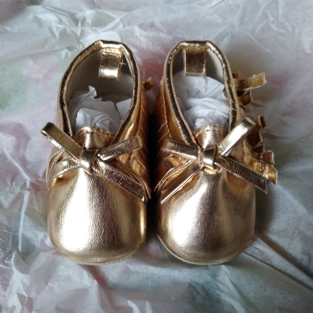 Gold baby moccasins